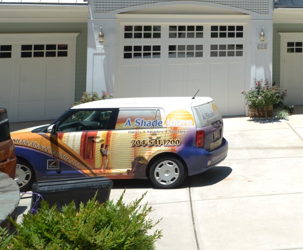 The A Shade Above–wrapped Scion xB Chad drove around Charlotte in the early days, parked in a customer's driveway.